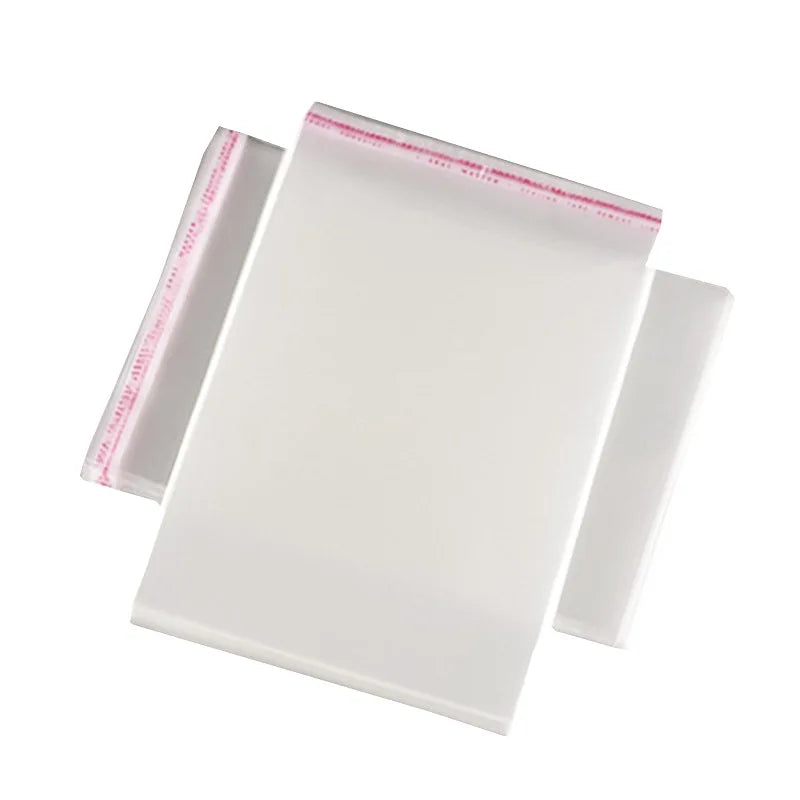 A pack of 100 self-sealing transparent plastic bags for jewelry, candy, and gifts.