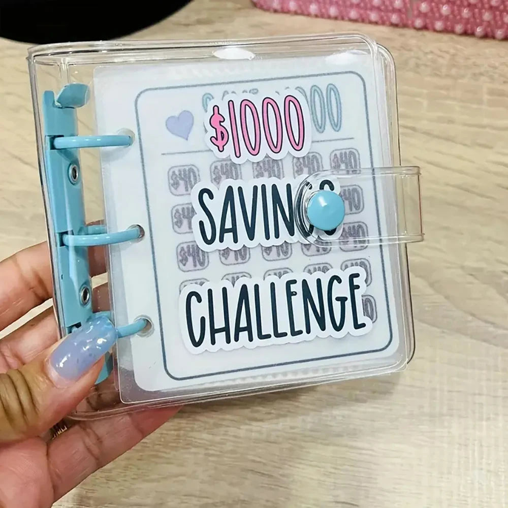 A clear plastic binder with a card inside showing a $1000 savings challenge budget plan.