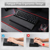 Ergonomic memory foam keyboard wrist rest with anti-slip base shown in use for fatigue-free typing.