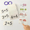 A collection of cards showing addition problems like 5+5, 3+5, and 4+4, with some featuring animals and flowers.