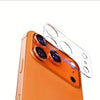 An orange smartphone shows a clear tempered glass camera lens protector being applied to the rear camera module.