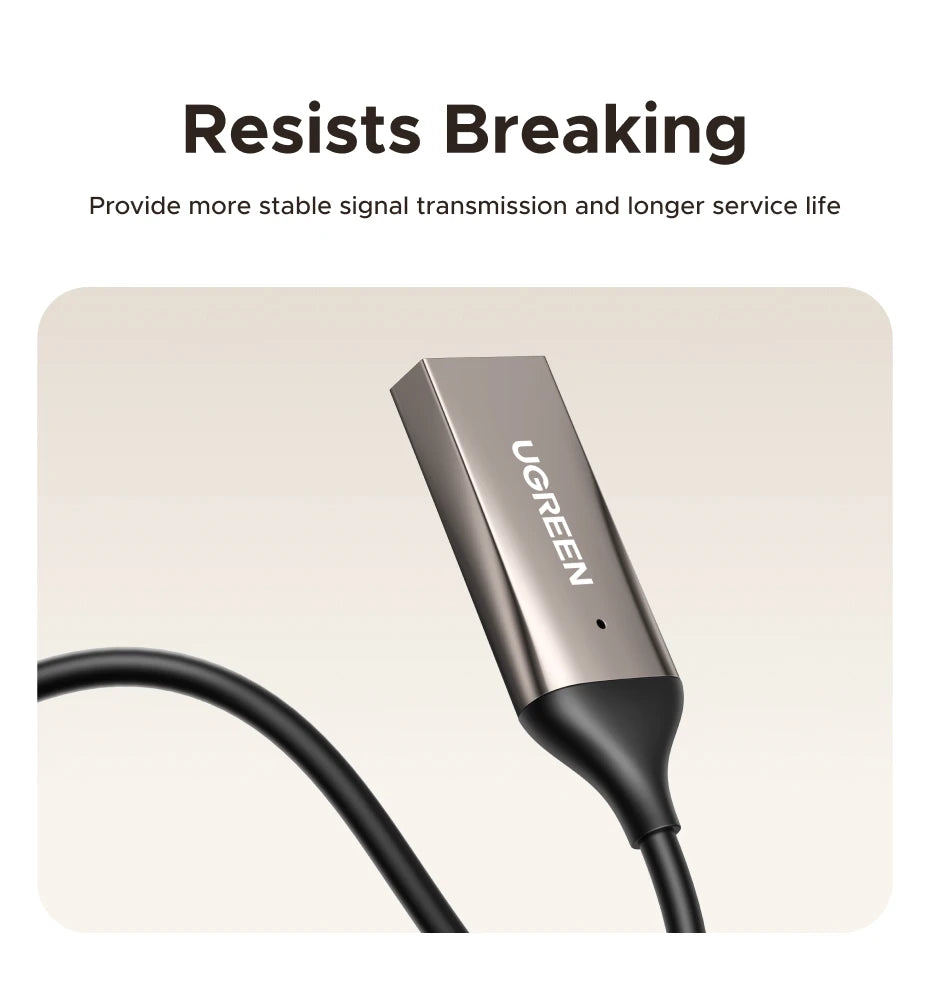 A close-up view of a silver portable Bluetooth car audio adapter with a microphone and black cable.
