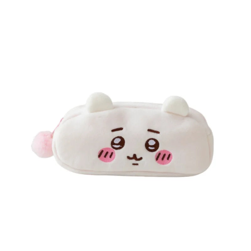 A white Chiikawa plush pencil case shaped like a cute animal face with pink accents.