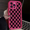 A pink phone case with a black and white checkered pattern is shown on a laptop.