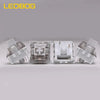 A set of four gray mechanical keyboard switches for hot-swap keyboards.