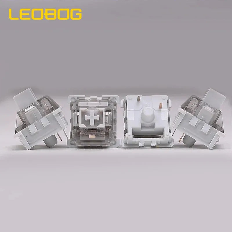 A set of four gray mechanical keyboard switches for hot-swap keyboards.