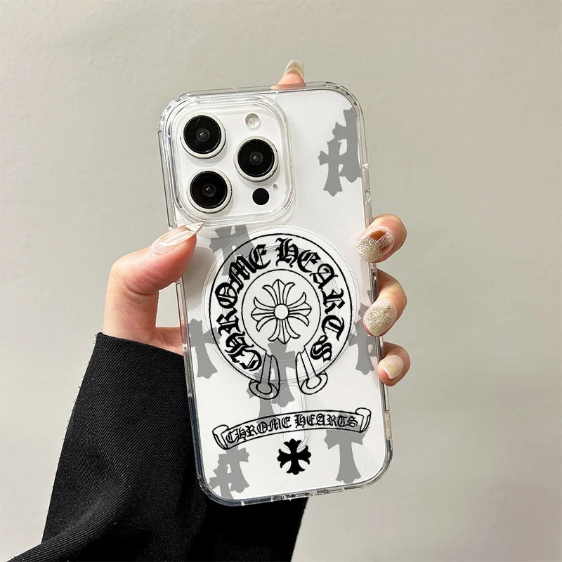 A hand holds a clear acrylic phone case featuring a black and white design of a horseshoe, heart, and floral elements.