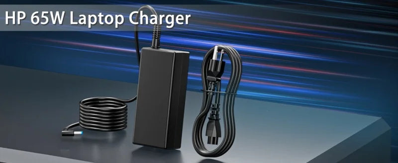 A black HP 65W laptop charger with a coiled cable is displayed on a dark surface.