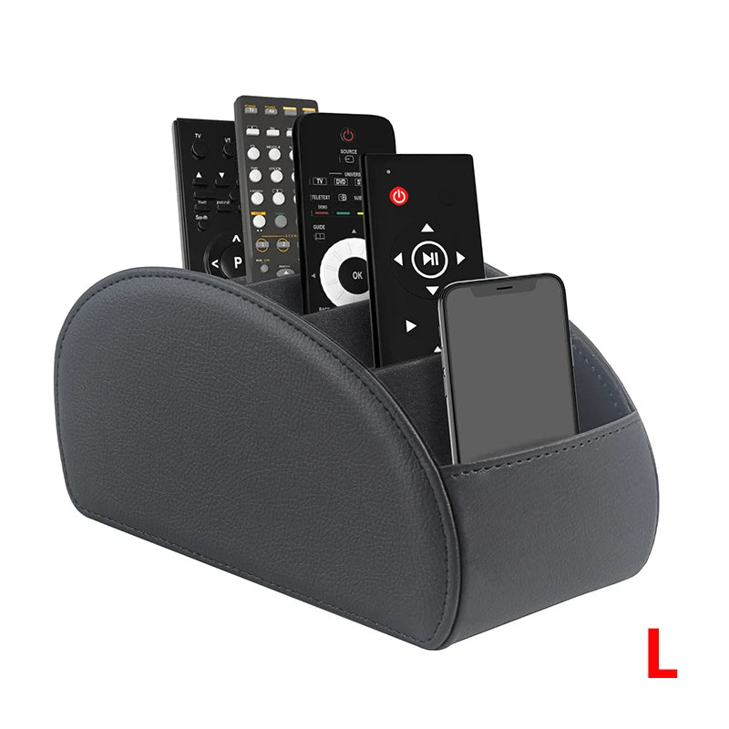 A gray PU leather caddy organizer holding a smartphone and three TV remotes.