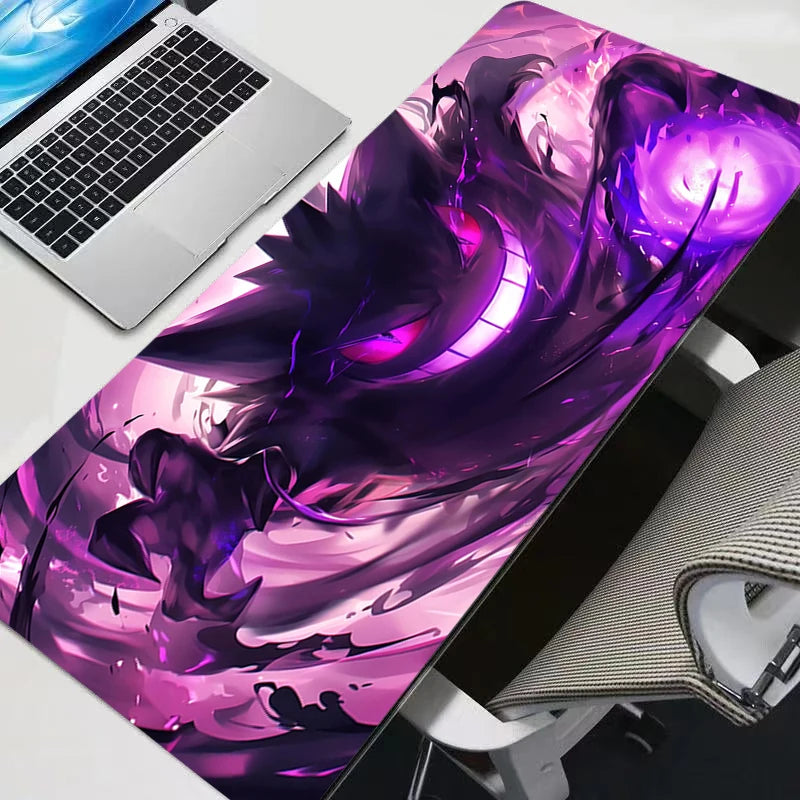A purple and pink gaming mouse pad featuring a fierce Gengar design on a white desk mat.