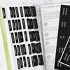 A close-up of laminated Bible tabs for easy reading showing various books like Genesis, Exodus, and Psalms.