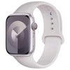 A silver silicone sport band for an Apple Watch displayed on a white background.
