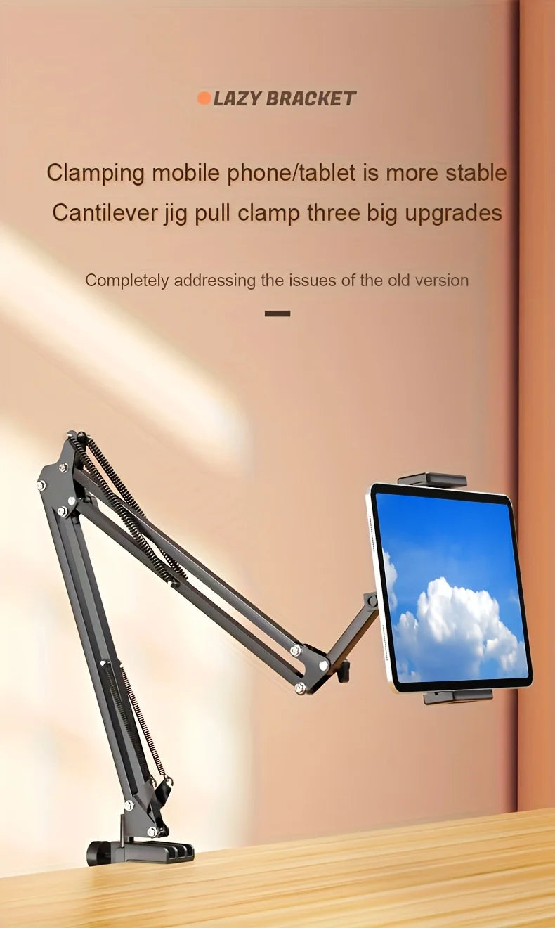 A black adjustable tablet holder with a cantilever jig design is shown on a wooden surface.