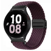 Schwarze Smartwatch mit lila gewebtem Armband, die Zeit 10:08 anzeigt.