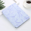 A purple and white marble-patterned silicone skin for an iPad Pro placed on a white surface.