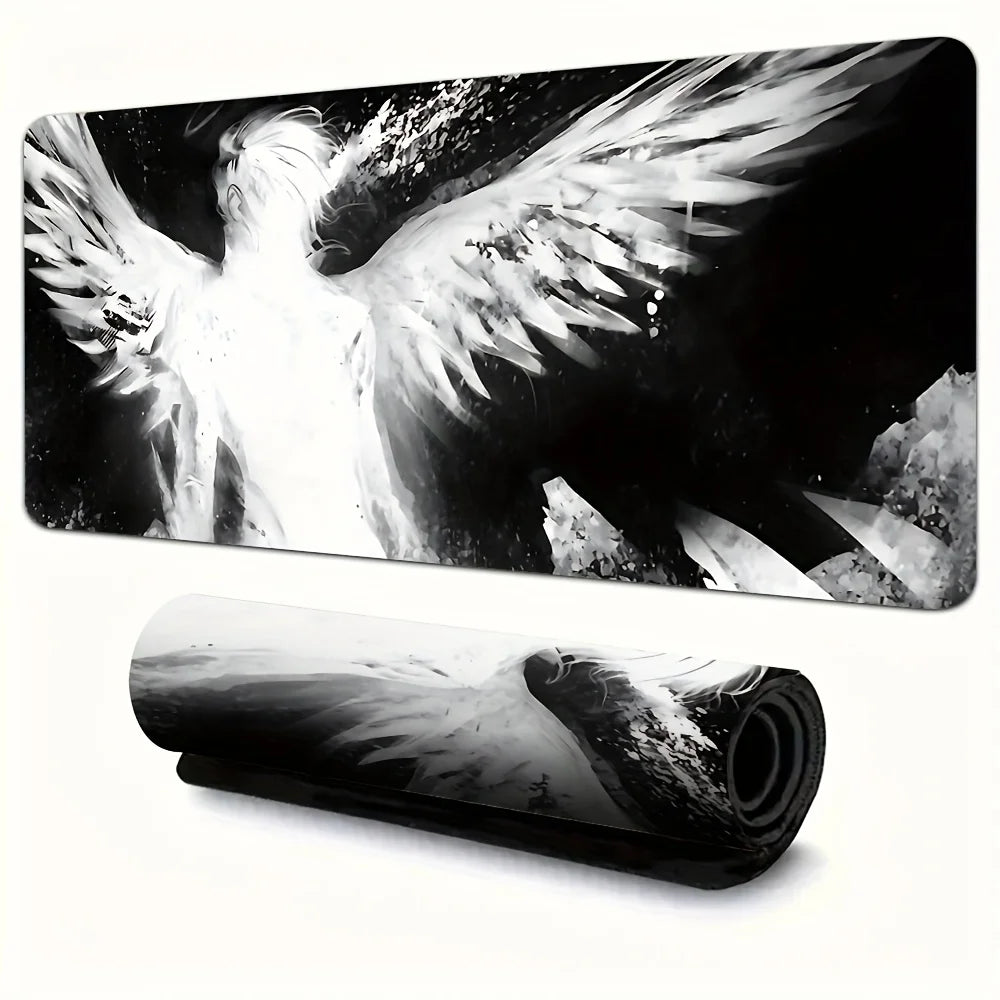Black and white artistic image of an angel wing on a desk mat or mouse pad