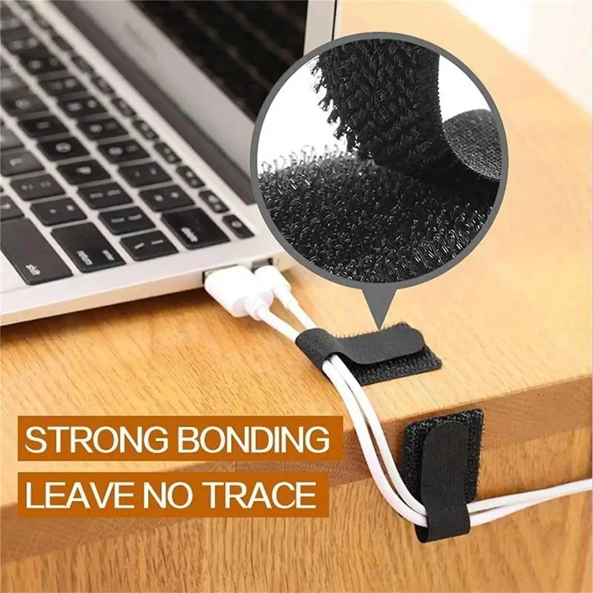 Reusable adhesive cable ties with a fuzzy texture are shown next to a laptop keyboard.