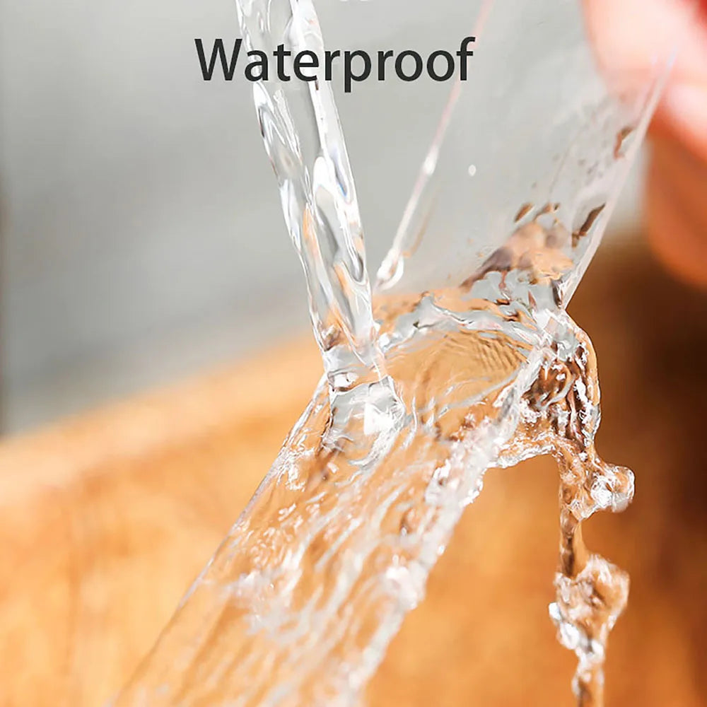 Close-up of a clear tape being tested for waterproof properties by dripping water.