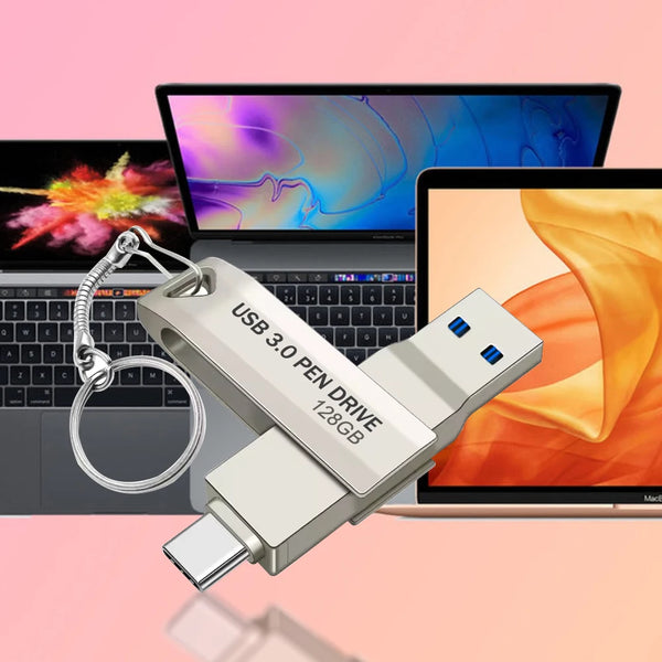 Clé USB 3.0 argentée avec porte-clés à côté d'un ordinateur portable affichant un fond coloré.
