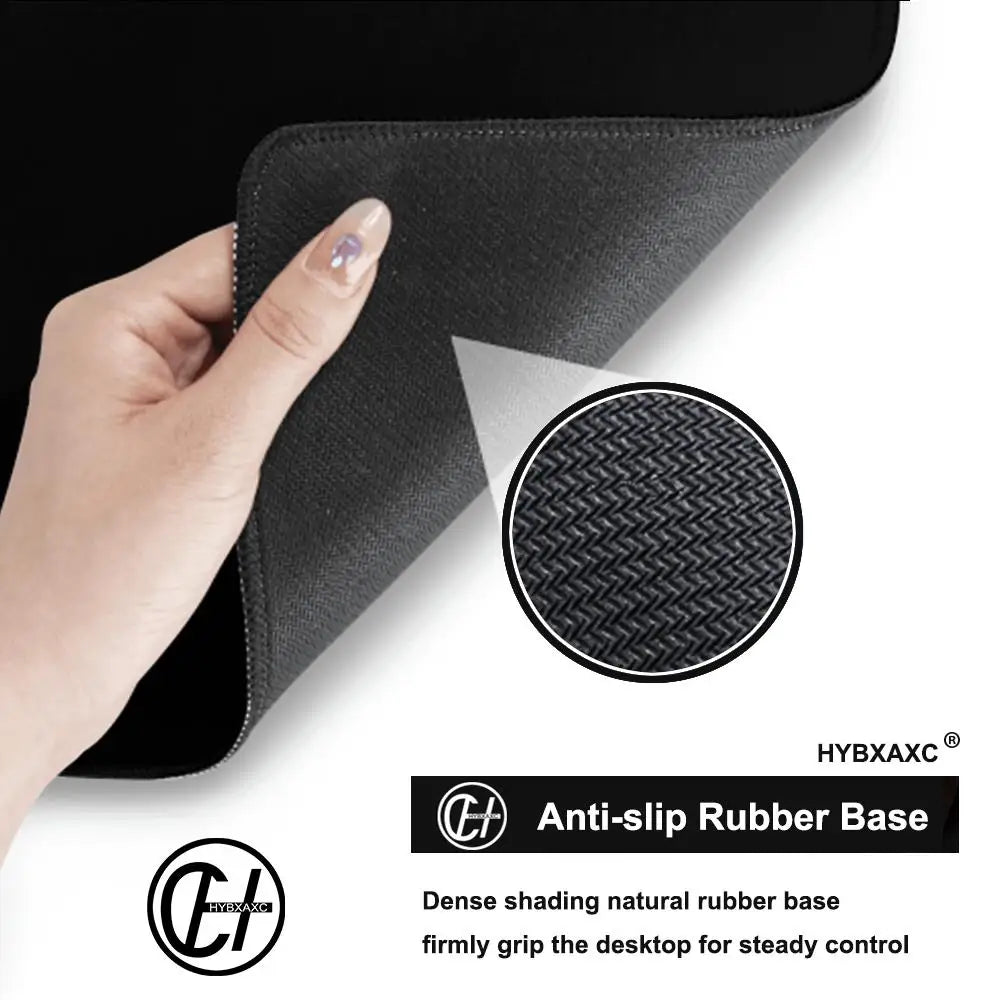 Hand holding a black anti-slip rubber base for a gaming mouse pad