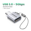 Aluminum silver USB 3.0 to 5Gbps adapter with a lanyard attached