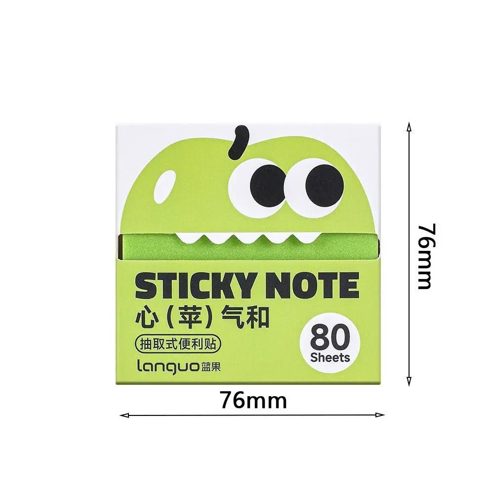 A package of green cartoon fruit sticky notes with a pear-shaped cutout and text in Japanese and English.