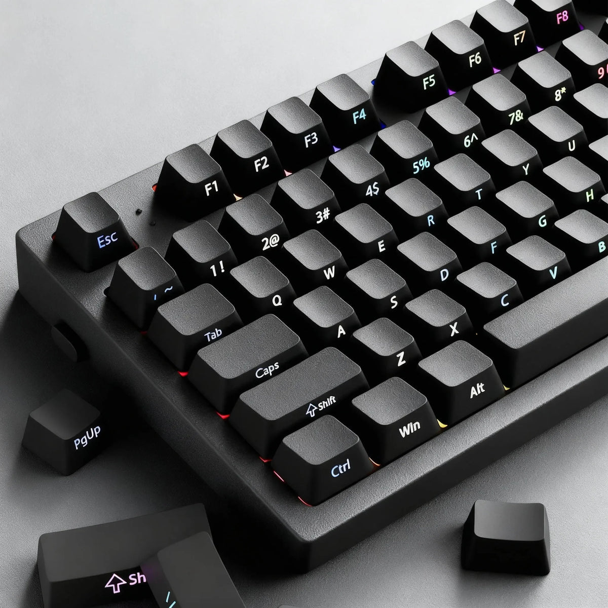 A close-up view of black PBT double-shot cherry profile keycaps for a mechanical keyboard.