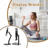 A woman is using a display bracket monitor stand for ergonomic viewing.