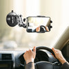 A hand is using a universal suction car phone mount with an articulating arm to hold a smartphone in a vehicle.