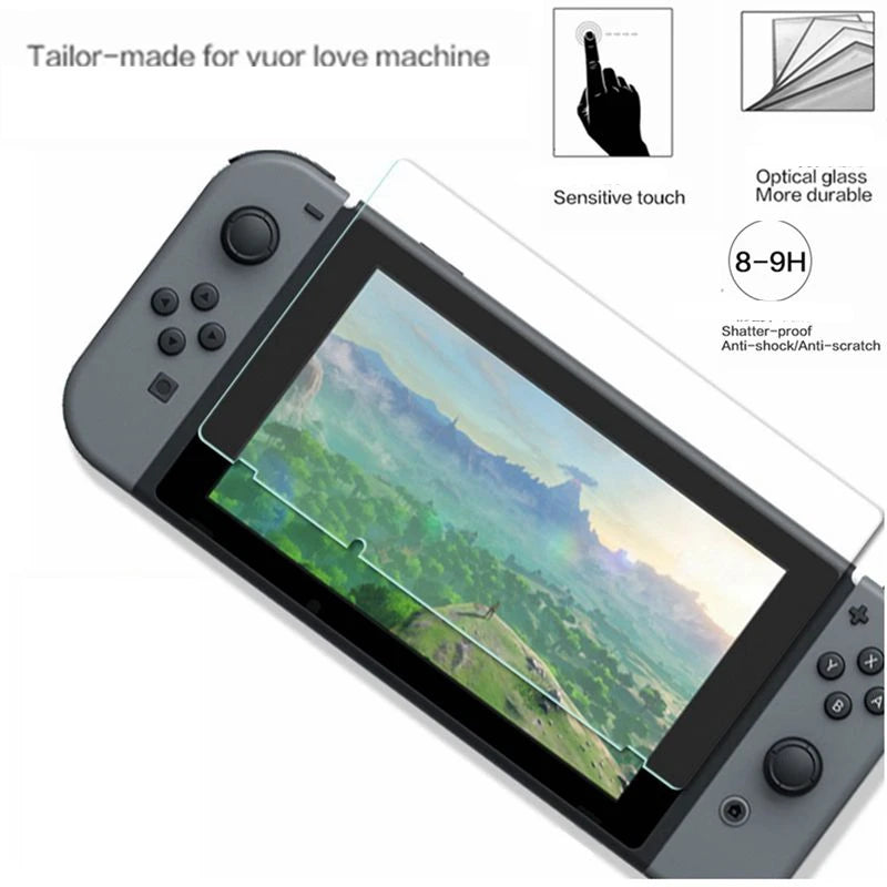 A gray Nintendo Switch OLED console with a clear tempered glass screen protector applied, showing a scenic landscape.