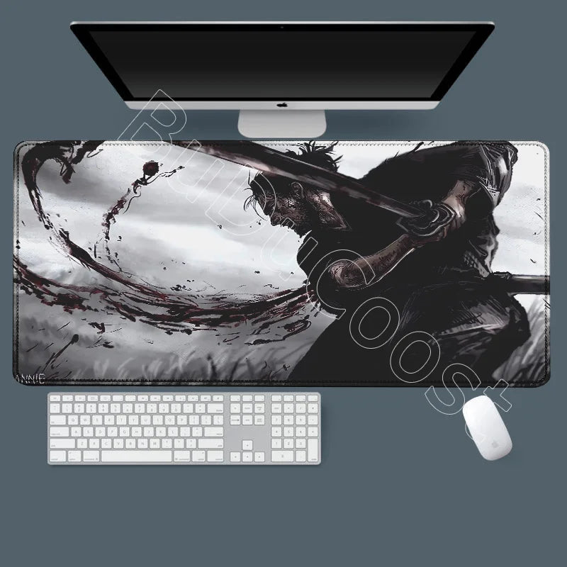 A large gaming mousepad featuring an illustration of Miyamoto Musashi from the Vagabond manga.