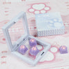 A set of purple cat paw and pink heart keycaps for MX switches displayed in their packaging.