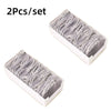 Two sets of cable organizer storage boxes containing multiple white cables for desk and travel use