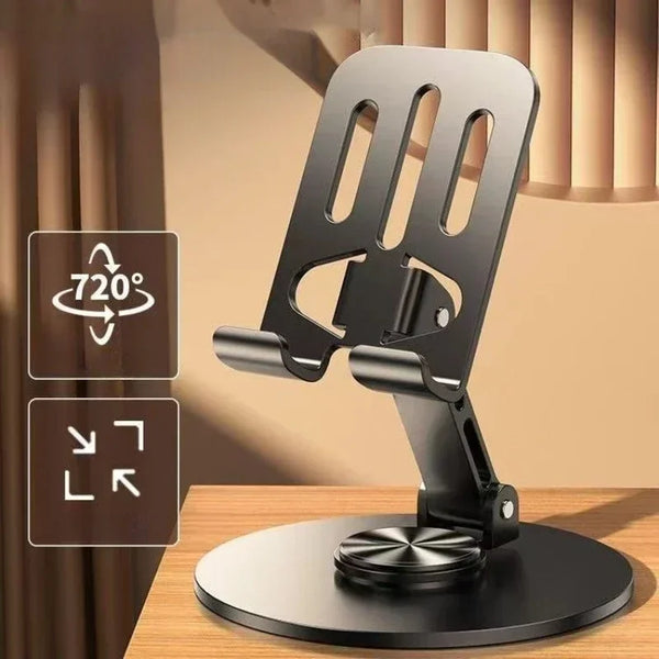 A black 360 degree rotating mobile phone holder mounted on a wooden surface.