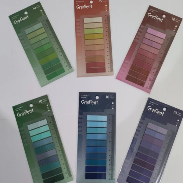 A collection of ten sheets of gradient colored sticky notes displayed in various shades of green, pink, and blue.