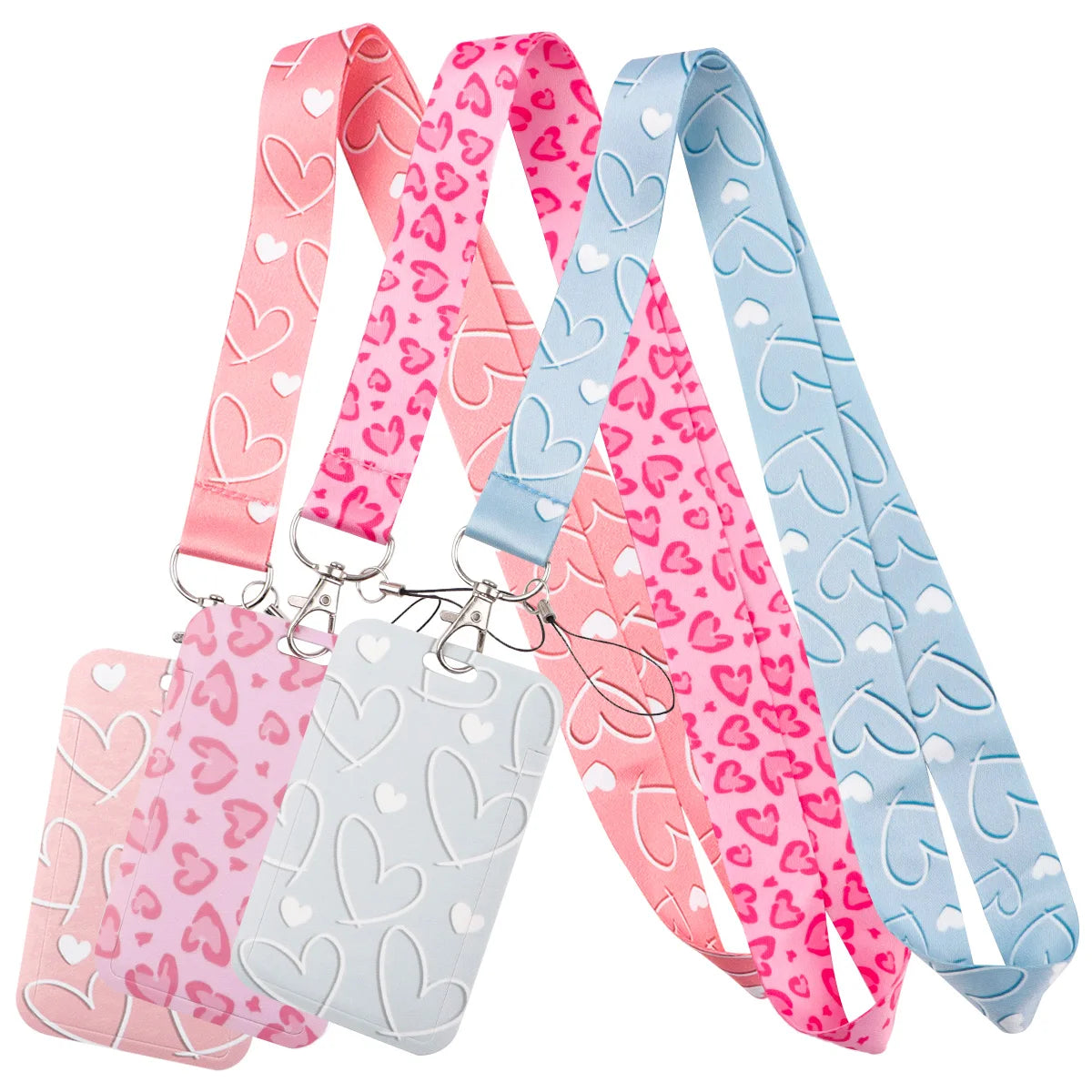 A set of pink, purple, and light blue heart-shaped lanyards for badges and keys.