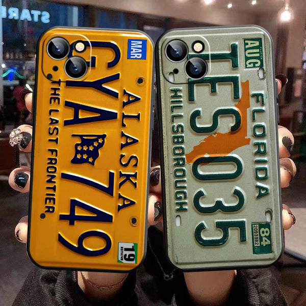 Coque de téléphone avec plaque d'immatriculation jaune 'Alaska 749' et verte 'Florida 035'.