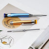 A set of six metal carpenter pencils with built-in sharpener caps in various colors, including blue, gold, and silver.