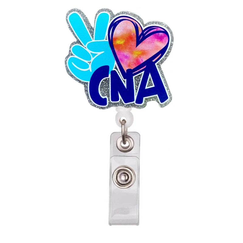 A cartoon medical badge reel holder featuring a blue and pink heart design and a blue fist sign.