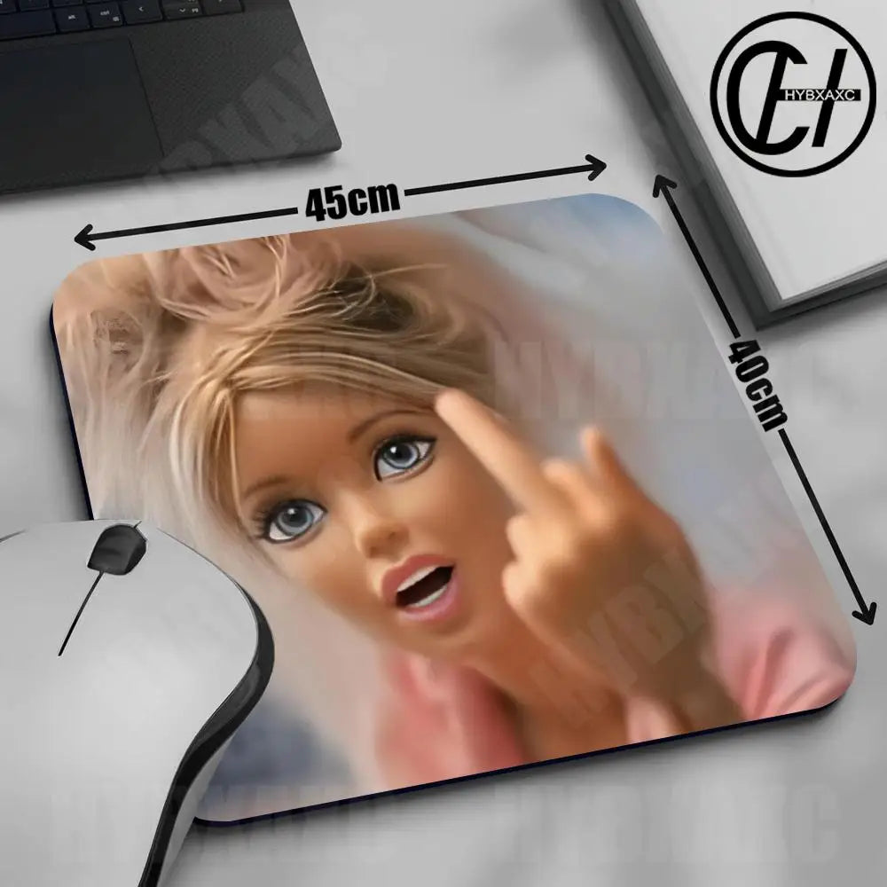 A mouse pad featuring a close-up image of a cute doll face with blonde hair and blue eyes.