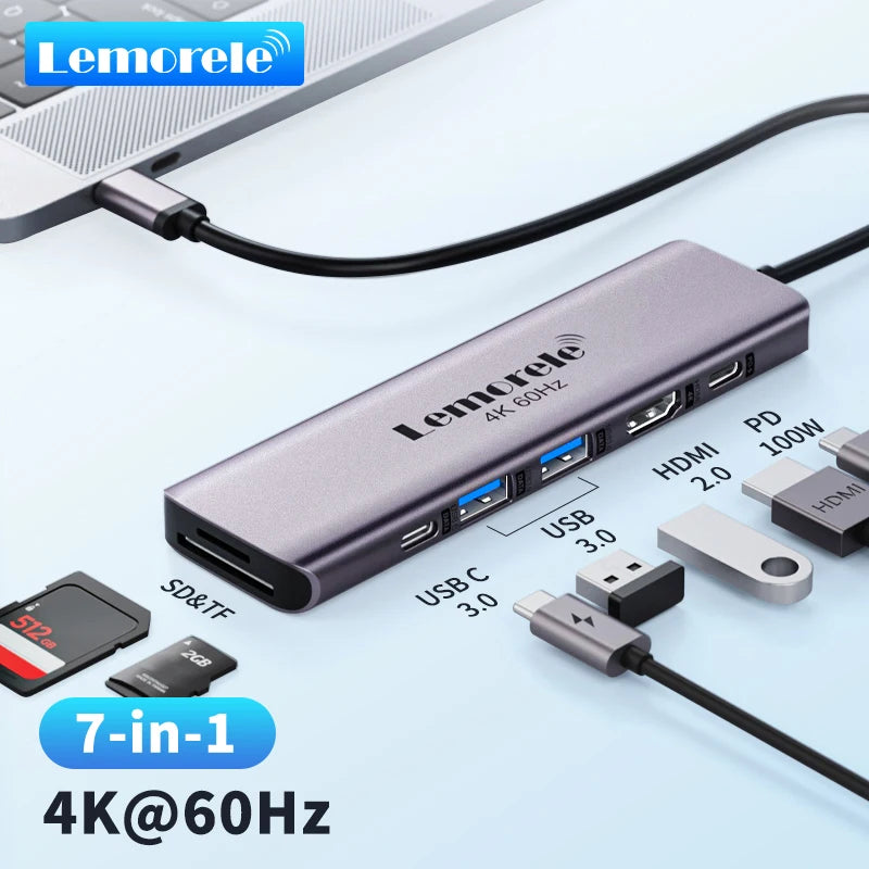 A purple 7-in-1 USB-C docking station with HDMI and SD card reader connected to a laptop.