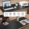 A large black desk mat features various compartments for a laptop, keyboard, printer, writing tools, and a small decorative i