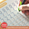 A hand writes numbers and letters on a practice sheet in a children's educational book.