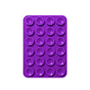 A purple reusable silicone suction phone mount with multiple circular suction cups.
