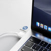 A close-up of a laptop and a charging cable demonstrating accurate charging and transmission.