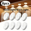 Eight pieces of white light/warm light LED motion sensor night lights displayed in a hanging rack context.
