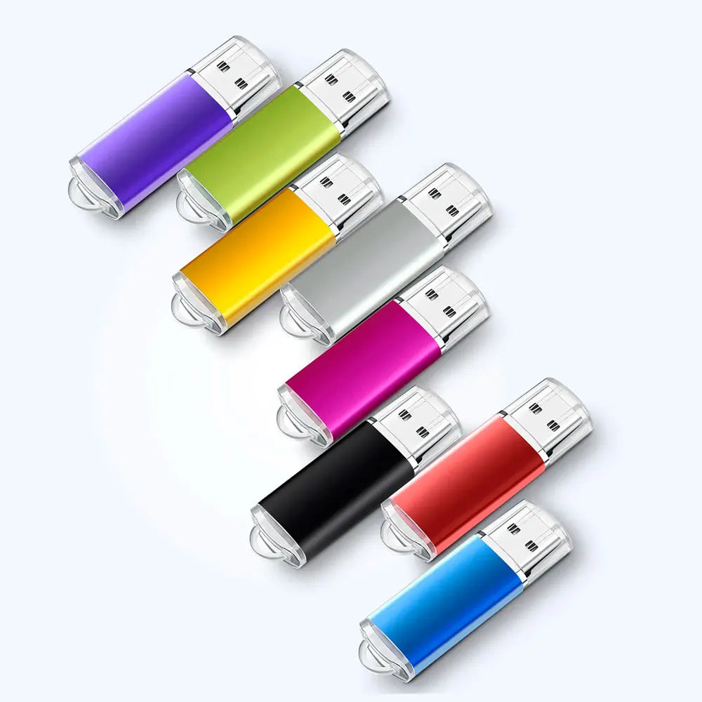 A collection of various colored metal USB flash drives arranged diagonally on a white background.