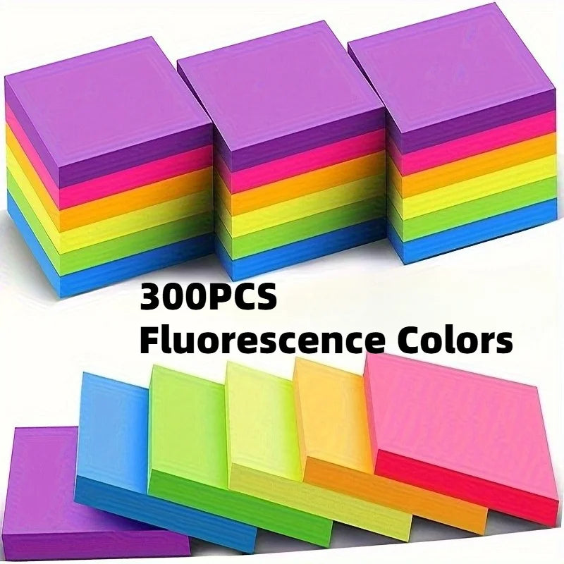 A stack of 300 fluorescent colors of self-adhesive sticky notes in various shades.