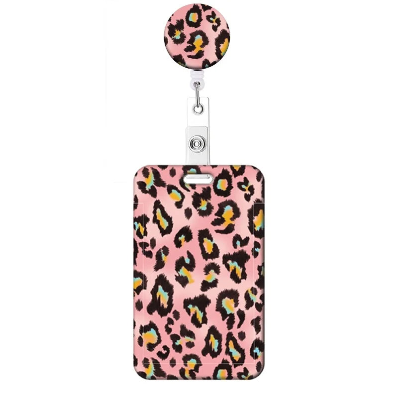 A leopard print retractable badge holder with a pink and black pattern.