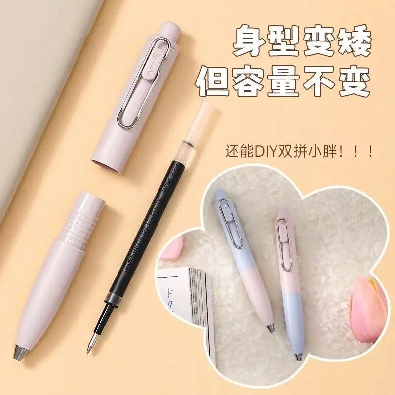 A set of pink and blue Uni-Ball One Mini cute gel pens shown in various angles with a black pen, highlighting their compact d